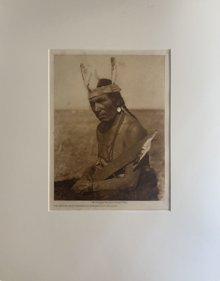 Item #274792 Fat Horse, with Insignia of a Blackfoot Soldier (original photogravure). Edward S. Curtis.